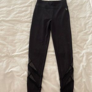 girls black leggings with mesh design/cut-out at the bottom